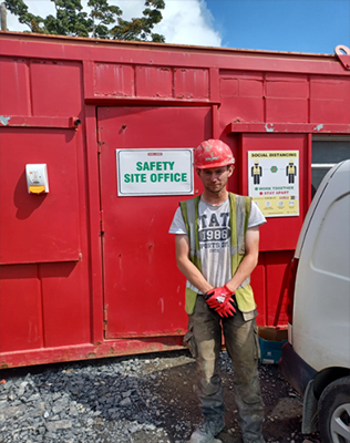 Brian McGeady in front of a Safety Site Office 