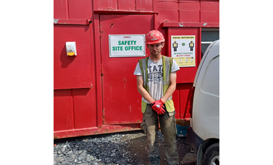 Brian McGeady in front of a Safety Site Office 