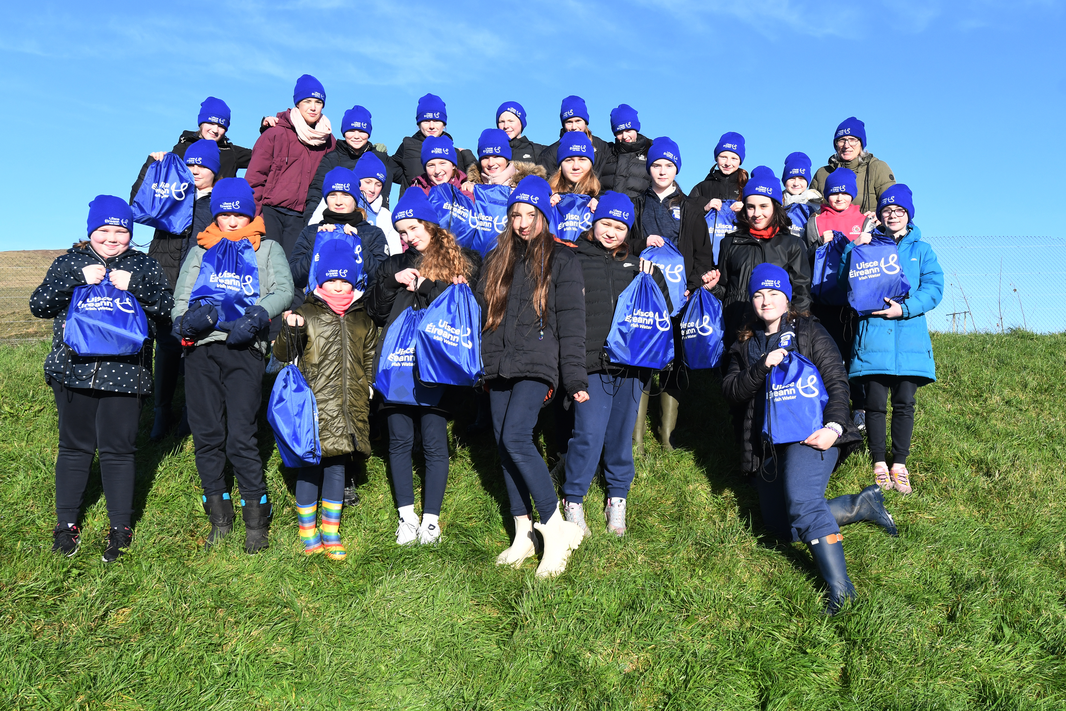 Children from Bunscoil an Chlochair planting trees at Dingle Water Treatment Plant