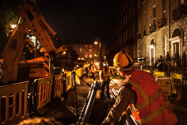 Man-working-with-pipes-at-night-(1)