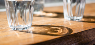 Three glasses of water on a table