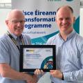 John Ward accepting an award by Alan Milton Head of Infrastructure Delivery Commercial Team