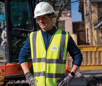 An Uisce Éireann engineer on a roadwork site