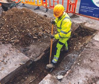 Worker in open trench