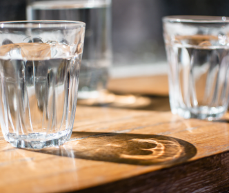 Three glasses of water on a table