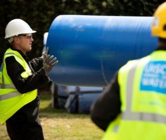 Uisce Éireann workers replacing blue pipes 