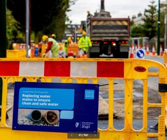 Uisce Éireann workers replacing water mains on the street
